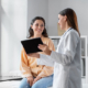 Woman speaking with female doctor